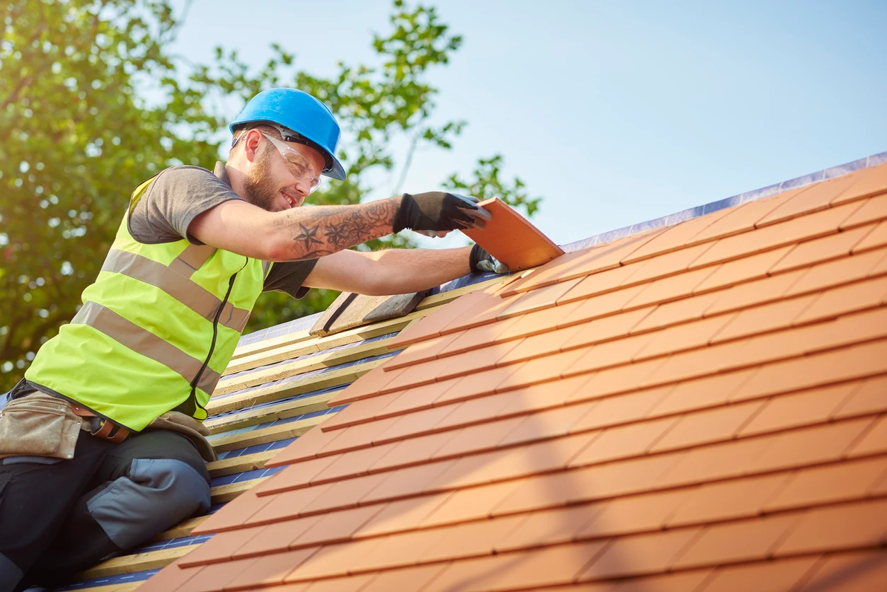 Roofer working on a residential roof